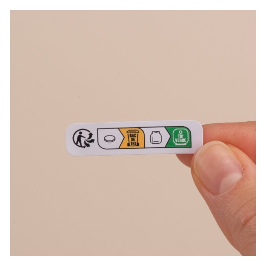 C'est une étiquette indiquant les options de recyclage pour différents types de déchets, y compris des symboles pour le tri des emballages et le verre.