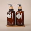 Etiquettes américaines rondes perforées attachées à des bouteilles cosmétiques