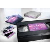 L'image montre différentes cassettes et diapositives de présentation liées à une réunion de vente de l'année 2014, mettant en avant le logo 'be Events'.